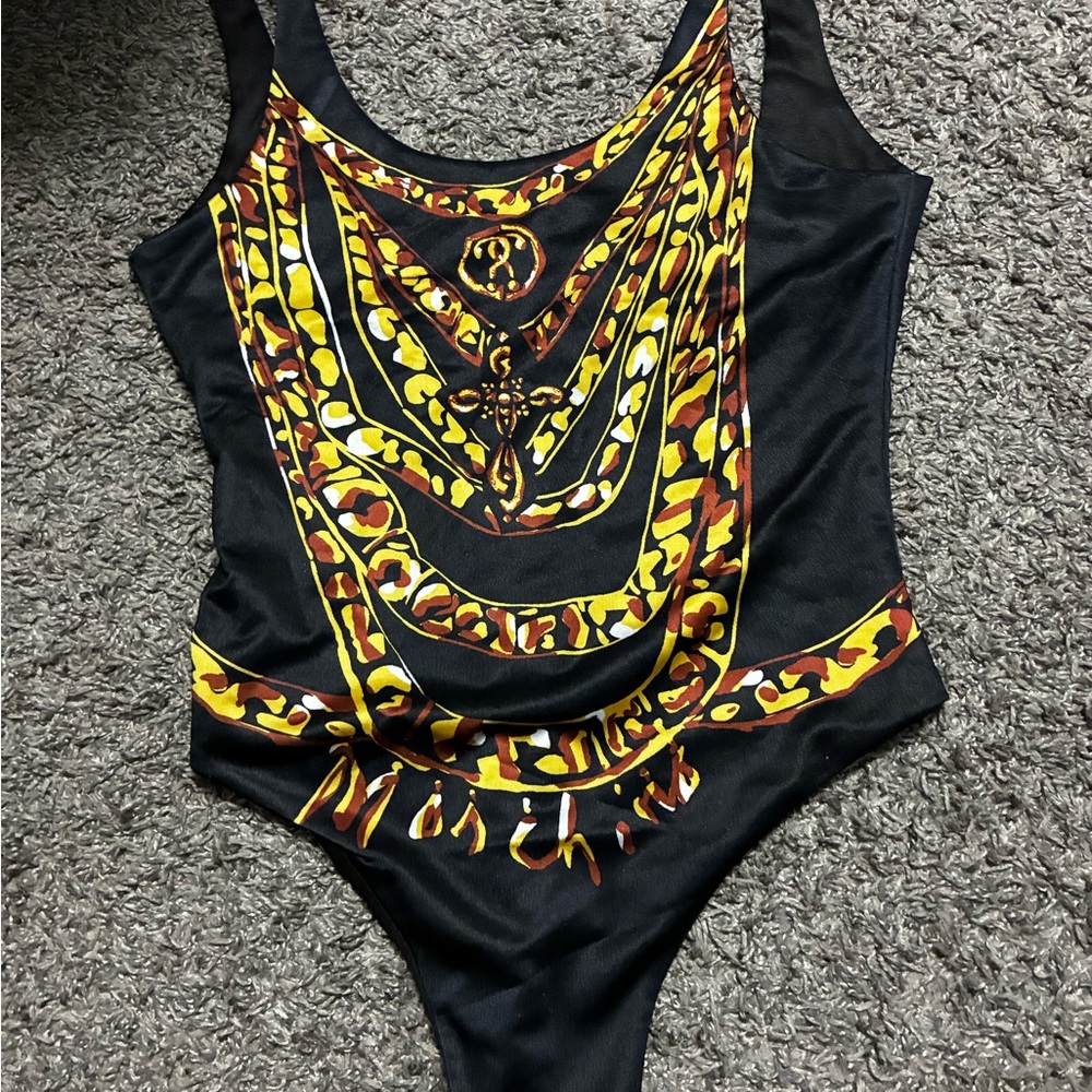 Stylish Black and Yellow woman One Piece says moschion